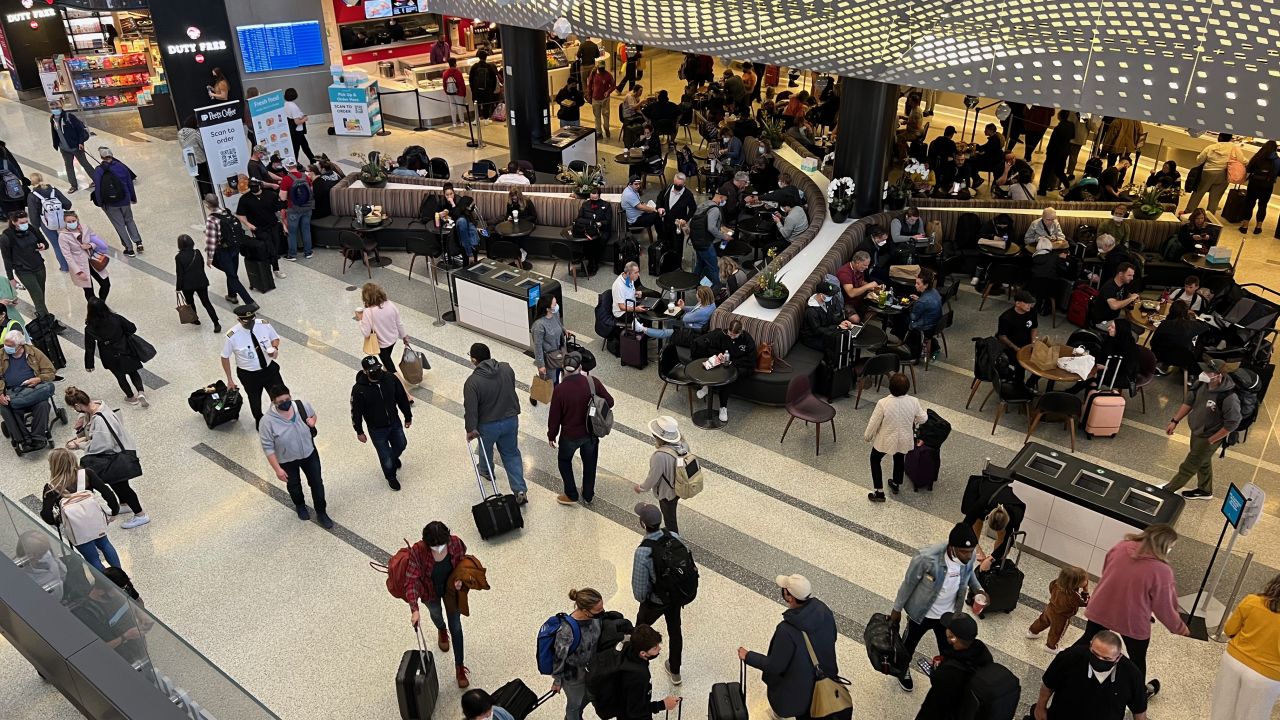 Passengers wait at Terminal 2 at Los Angeles International Airport on March 29, 2022. 