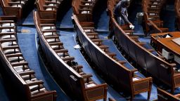 WASHINGTON, DC - JANUARY 3: Capitol workers disinfect the House floor in the Capitol before members of the 117th Congress are sworn in on January 3, 2021 in Washington, DC. Both chambers are holding rare Sunday sessions to open the new Congress on January 3 as the Constitution requires. (Photo By Bill Clark - Pool/Getty Images)