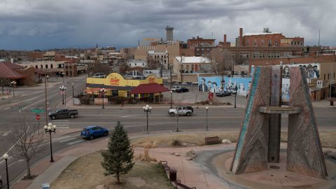 Cars drive through downtown Pueblo on March 29.