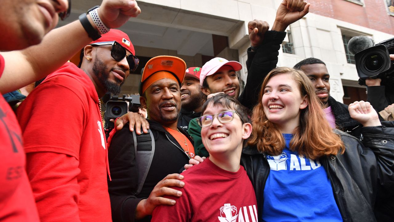 Union organizer Christian Smalls (L) celebrates following the April 1, 2022, vote for the unionization of the Amazon Staten Island warehouse in New York.