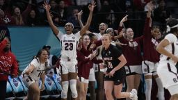 South Carolina's Bree Hall reacts from the bench after a three-point basket during the second half of a college basketball game in the semifinal round of the Women's Final Four NCAA tournament Friday, April 1, 2022, in Minneapolis. (AP Photo/Charlie Neibergall)