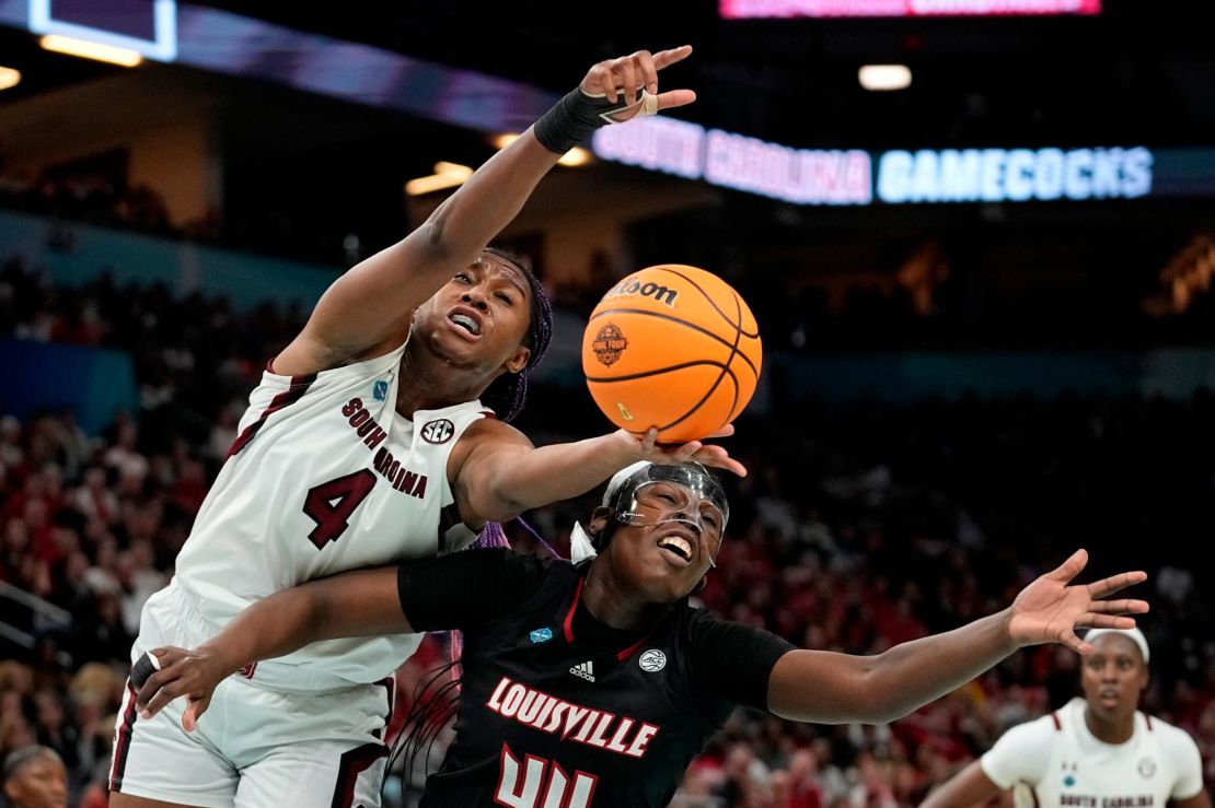 South Carolina's Aliyah Boston and Louisville's Olivia Cochran go after a loose ball during the first half of their game Friday night.
