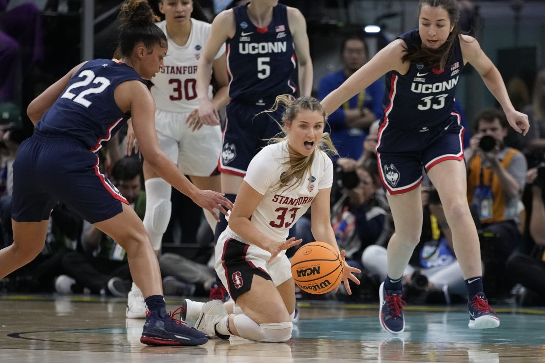 Stanford's Hannah Jump goes after a loose ball between UConn's Evina Westbrook and Caroline Ducharme Friday night in Minneapolis. 