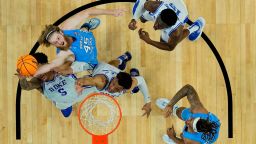 North Carolina forward Brady Manek (45) Duke forward Wendell Moore Jr. (0) and Duke forward Paolo Banchero (5) vie for a rebound during the second half of a college basketball game in the semifinal round of the Men's Final Four NCAA tournament, Saturday, April 2, 2022, in New Orleans. (AP Photo/Brynn Anderson)