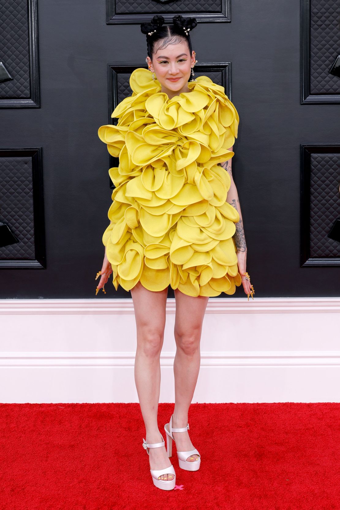 Michelle Zauner of Japanese Breakfast wore a bright yellow Valentino dress, completing the look with elaborate nail art.