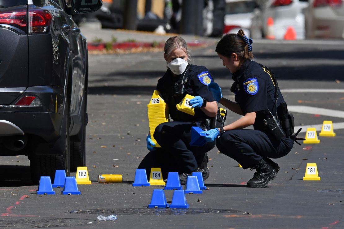 Sacramento police crime scene investigators work the scene on 10th Street.