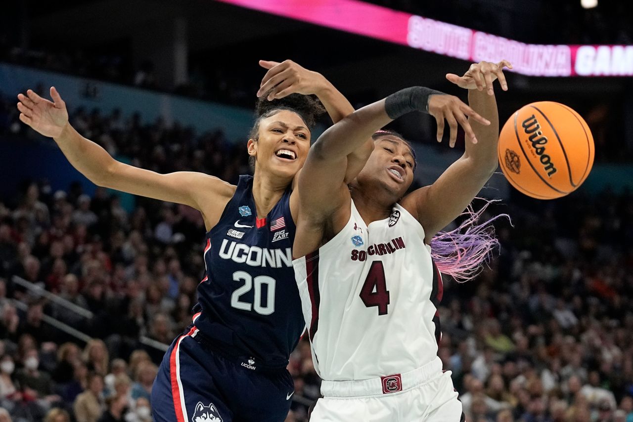 Boston and UConn's Olivia Nelson-Ododa go after a loose ball during the first quarter.