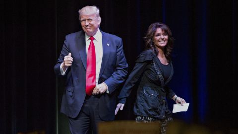 Donald Trump arrives after being introduced by Sarah Palin, former Republican governor of Alaska, during a campaign event in Wisconsin on Saturday, April 2, 2016.