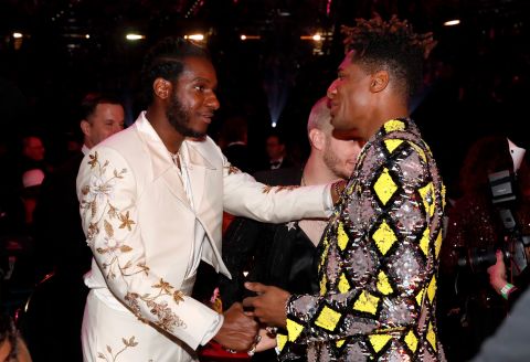 Leon Bridges, left, and Batiste greet each other at the show.