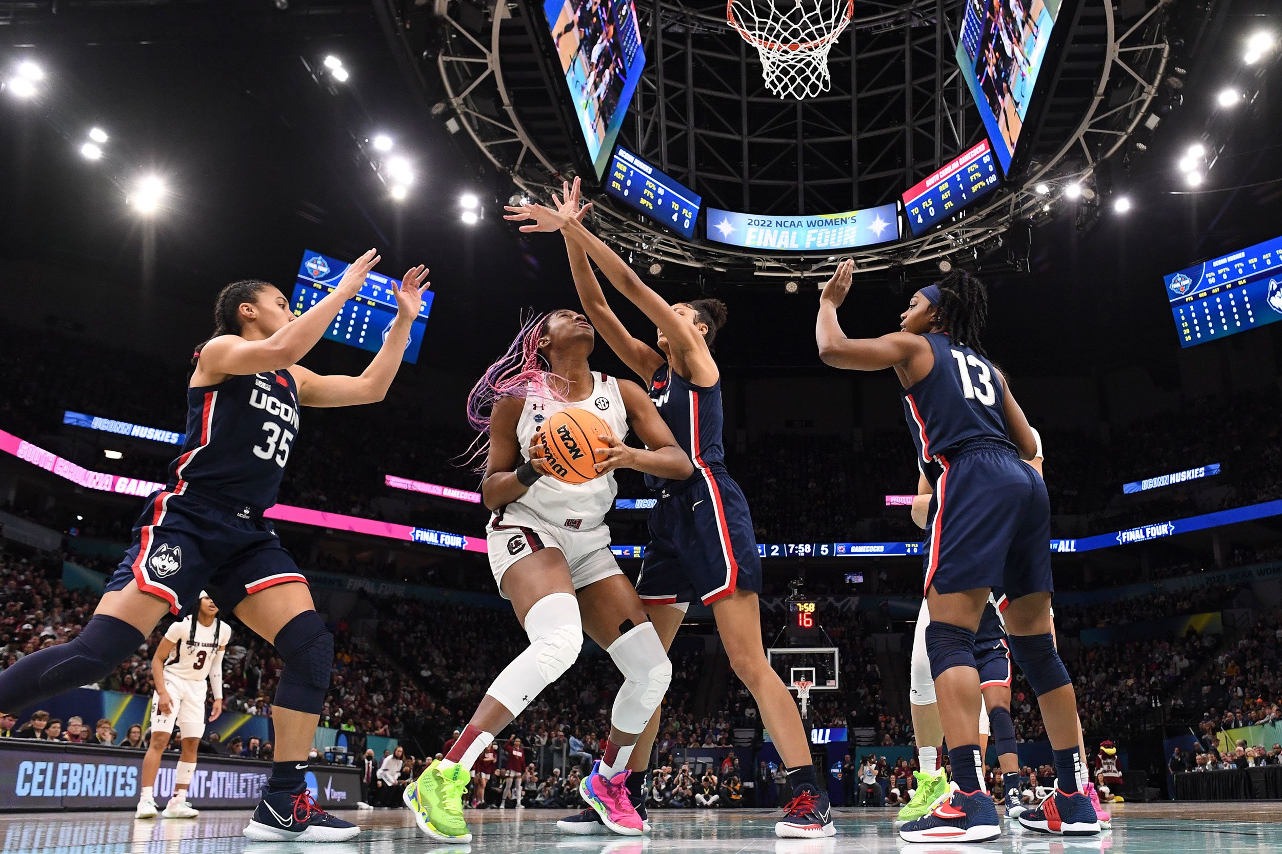 Boston is swarmed by a group of UConn defenders.