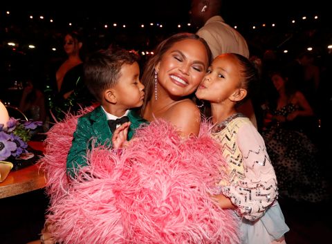 Chrissy Teigen attends the show with her children, Miles and Luna.
