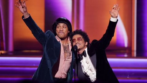 LAS VEGAS, NEVADA - APRIL 03: (L-R) Anderson .Paak and Bruno Mars of Silk Sonic accept the Record Of The Year award for 'Leave The Door Open' onstage during the 64th Annual GRAMMY Awards at MGM Grand Garden Arena on April 03, 2022 in Las Vegas, Nevada. (Photo by Rich Fury/Getty Images for The Recording Academy)