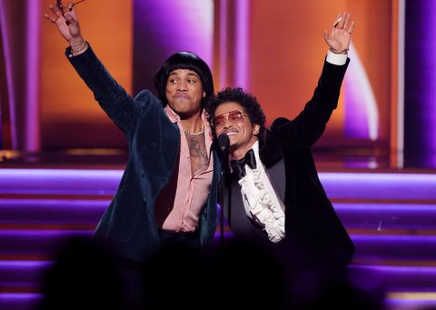 Anderson .Paak, left, and Bruno Mars accept the Record of the Year Grammy for Silk Sonic's "Leave the Door Open" on Sunday, April 3.