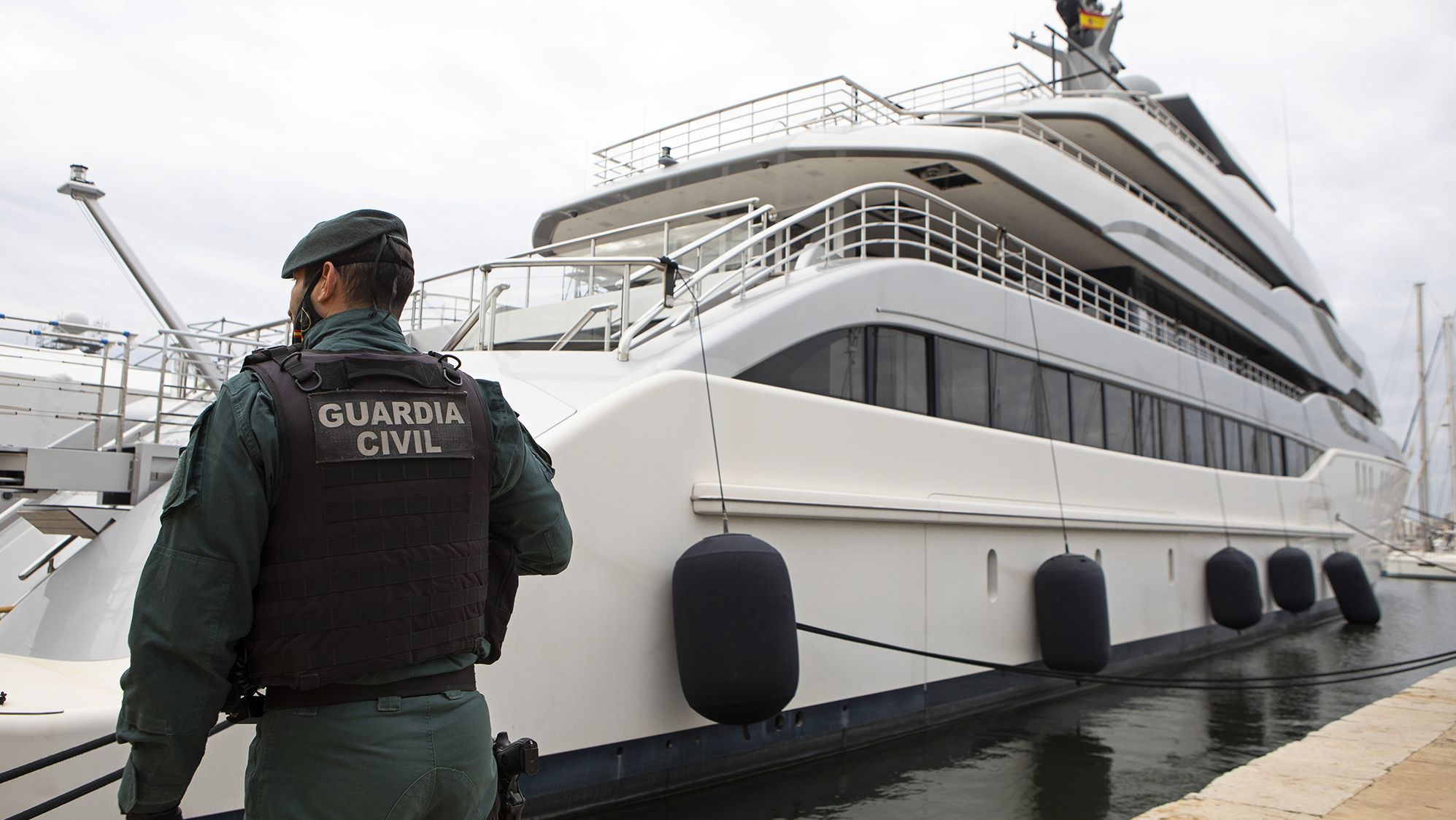 A Civil Guard stands by the yacht called Tango in Palma de Mallorca, Spain, Monday April 4, 2022.
