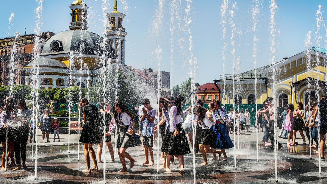 This was taken on May 30, 2018 in Kyiv, the capital of Ukraine, by Ukrainian-born photographer Dina Litovsky. After the Last Bell ceremony in schools, students from around the city go to the Podil area of Kyiv to bathe in a fountain. 