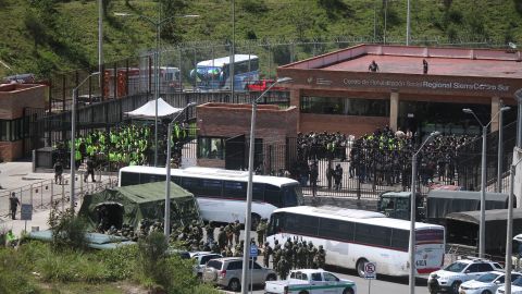 Police and military are seen outside Turi prison on Monday.