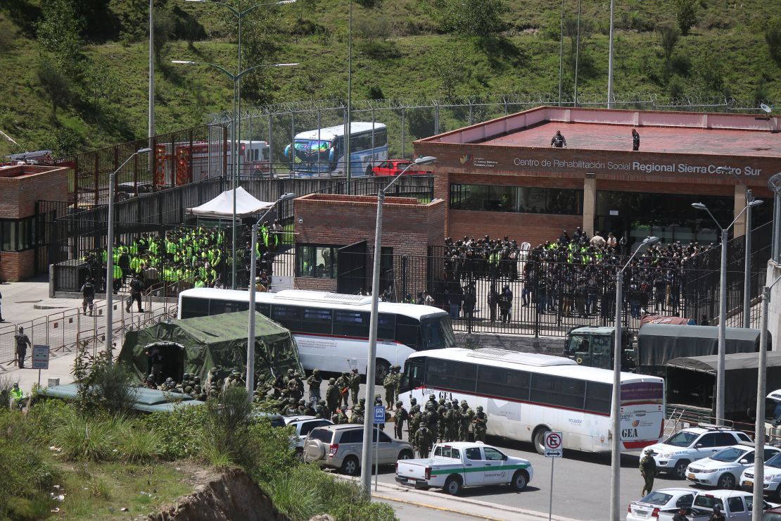 Police and military are seen outside Turi prison on Monday.