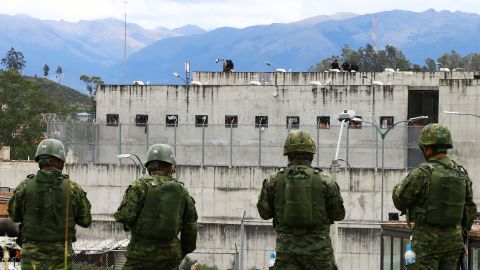 Soldiers stand outside Turi prison, near Cuenca, on Sunday.