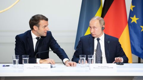 French President Emmanuel Macron speaks to his Russian counterpart Vladimir Putin at a December 2019 summit. Macron took a leading role in trying to avert war in Ukraine.