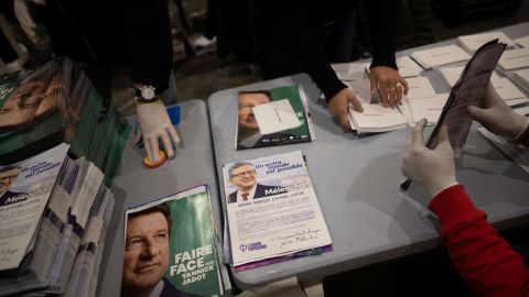 Public servants prepare election materials to be mailed to voters, less than a week out from the first round of France's presidential vote.