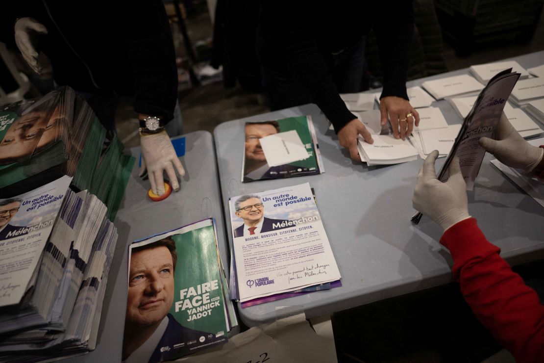 Public servants prepare election materials to be mailed to voters, less than a week out from the first round of France's presidential vote.