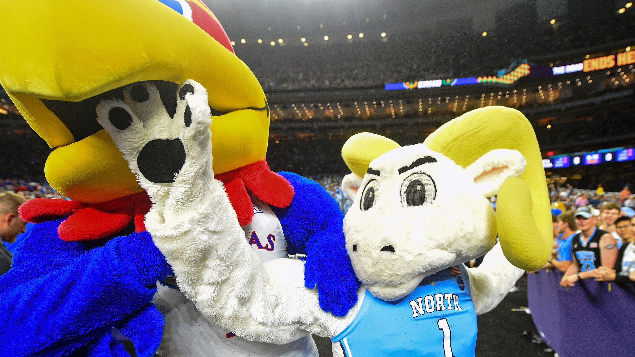 The two teams' mascots play around before the game.