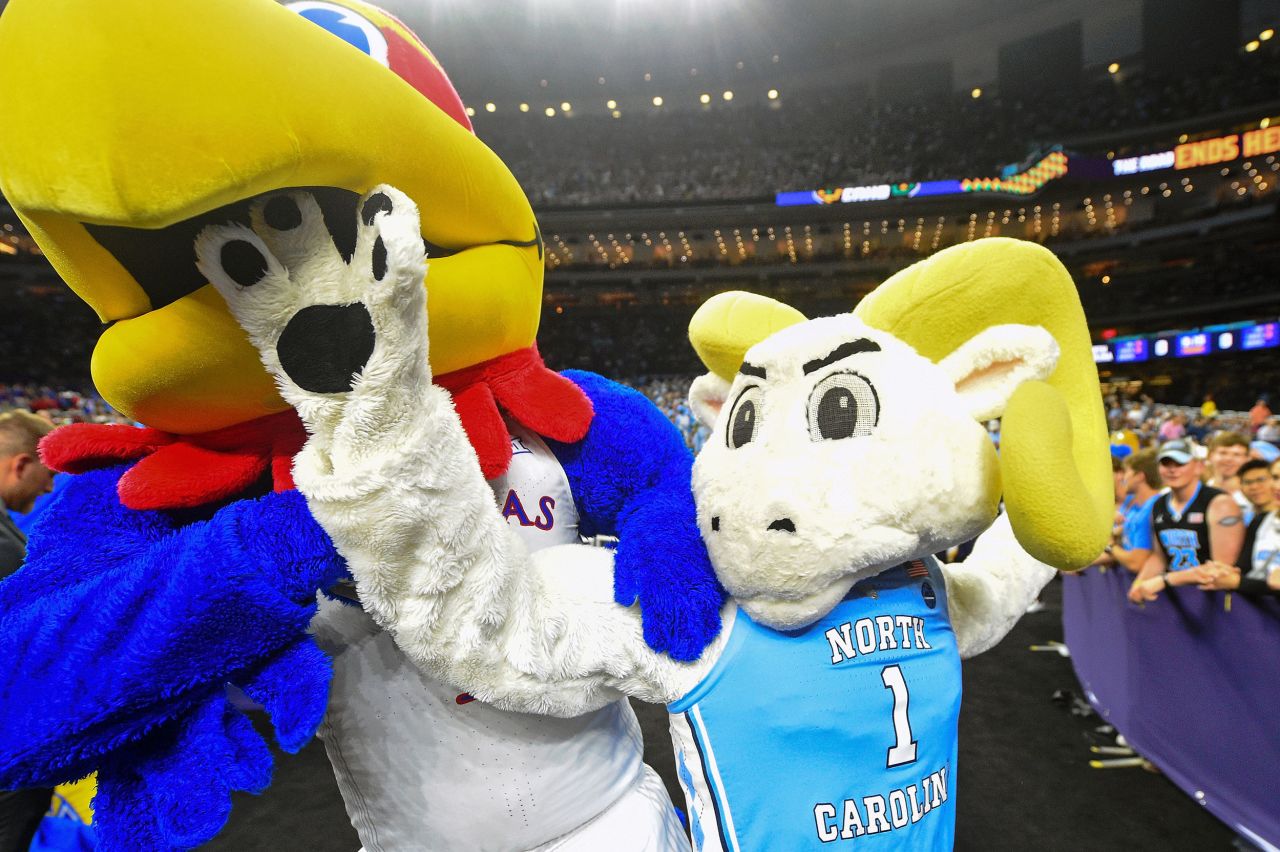 The two teams' mascots play around before the game.