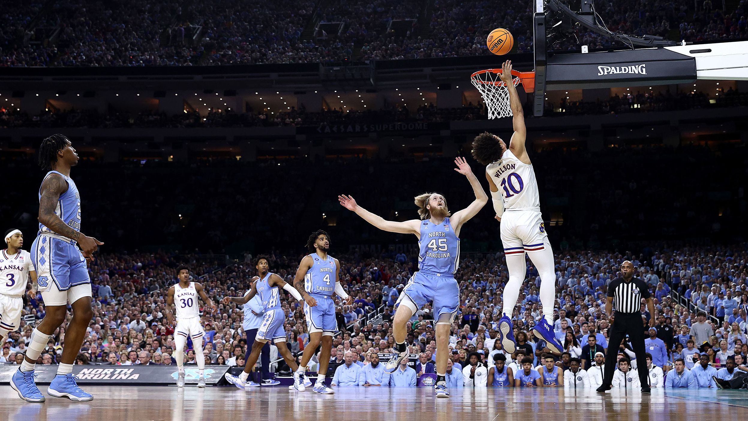 Wilson drives to the basket.