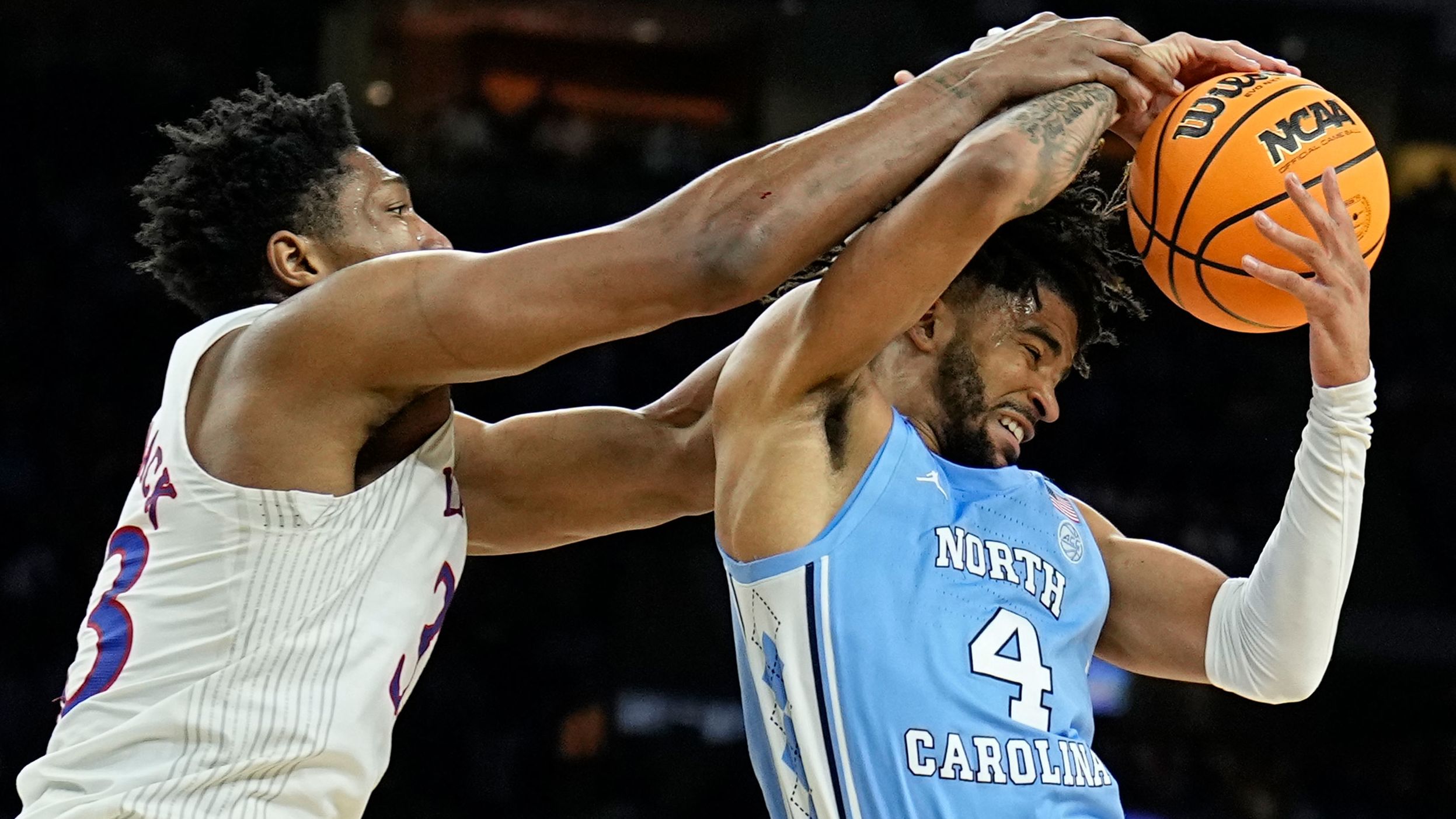 McCormack battles North Carolina guard RJ Davis for a rebound during the second half.