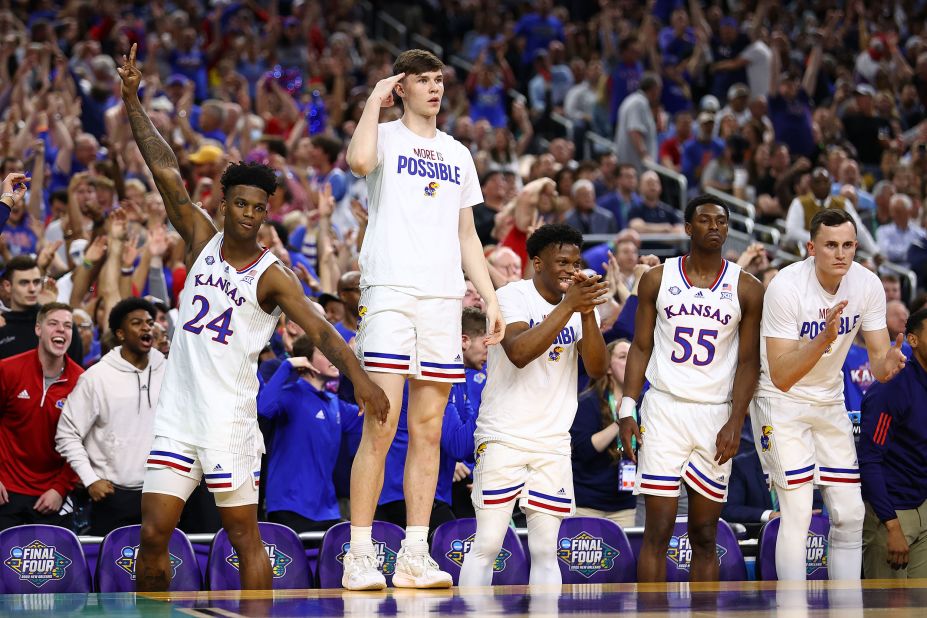 The Kansas bench reacts during the team's second-half comeback.