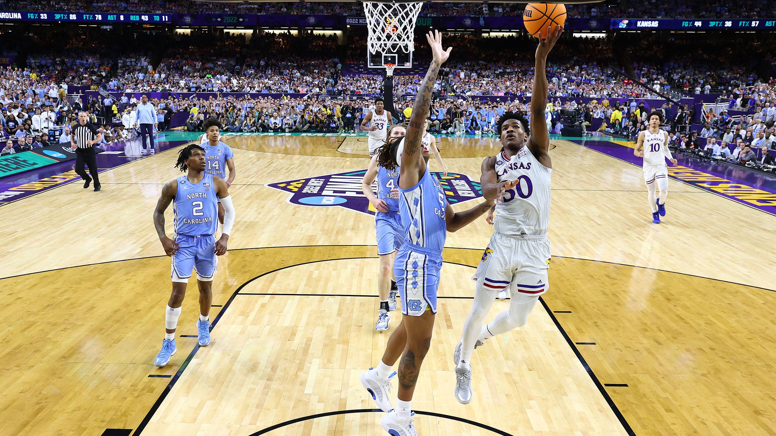Agbaji rises for a shot over Bacot.
