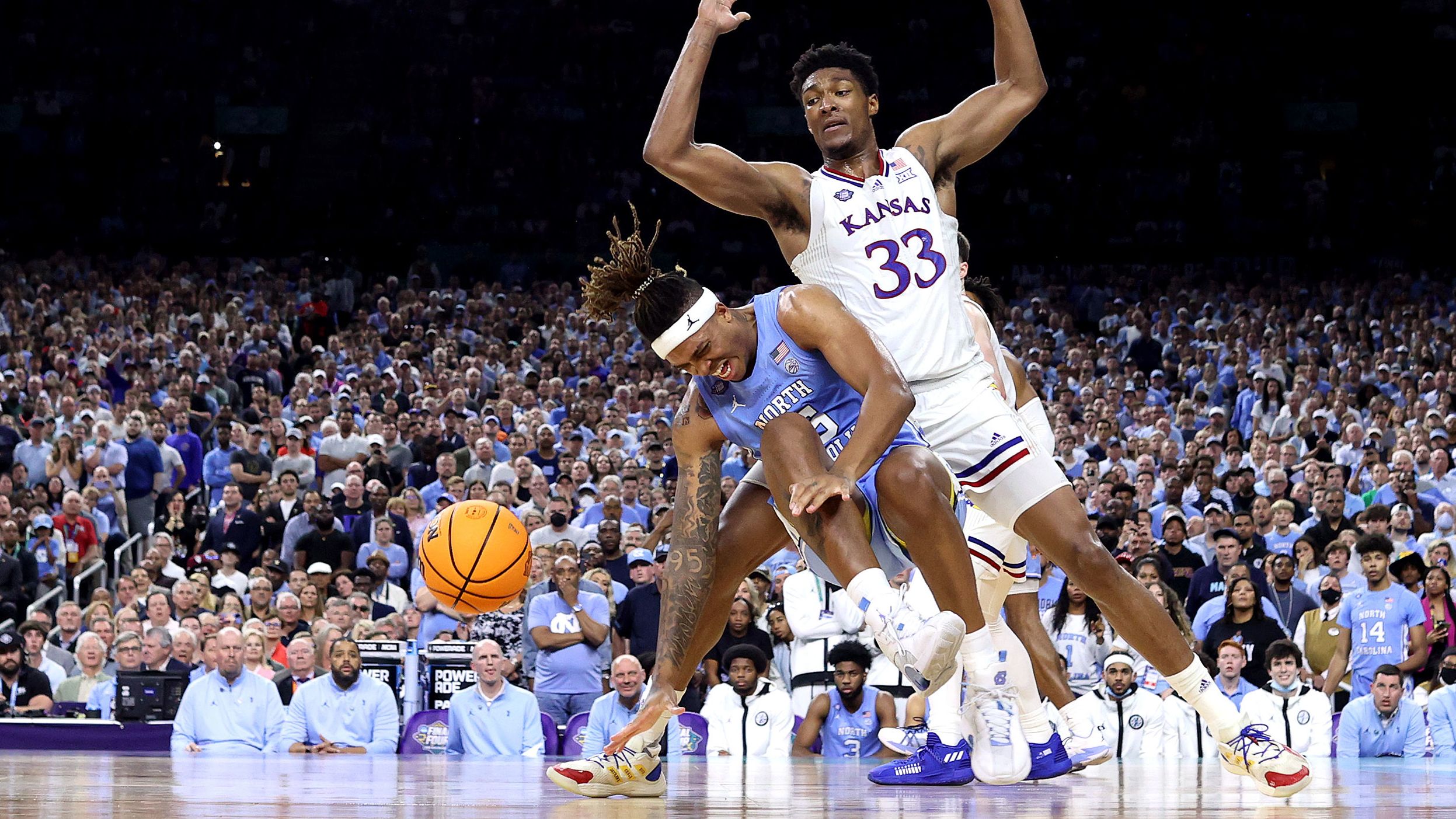 North Carolina's Armando Bacot turns his injured right ankle during a key play late in the game. Bacot initially hurt the ankle in the semifinal game against Duke.