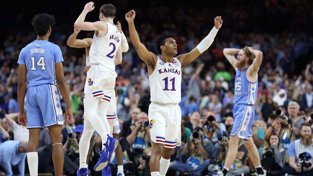 Remy Martin #11, Jalen Wilson #10 and Christian Braun #2 of the Kansas Jayhawks react in the second half of the championship game against the North Carolina Tar Heels in New Orleans.
