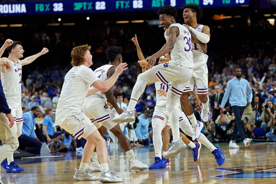 Kansas players celebrate after winning the national championship game against North Carolina on Monday, April 4.