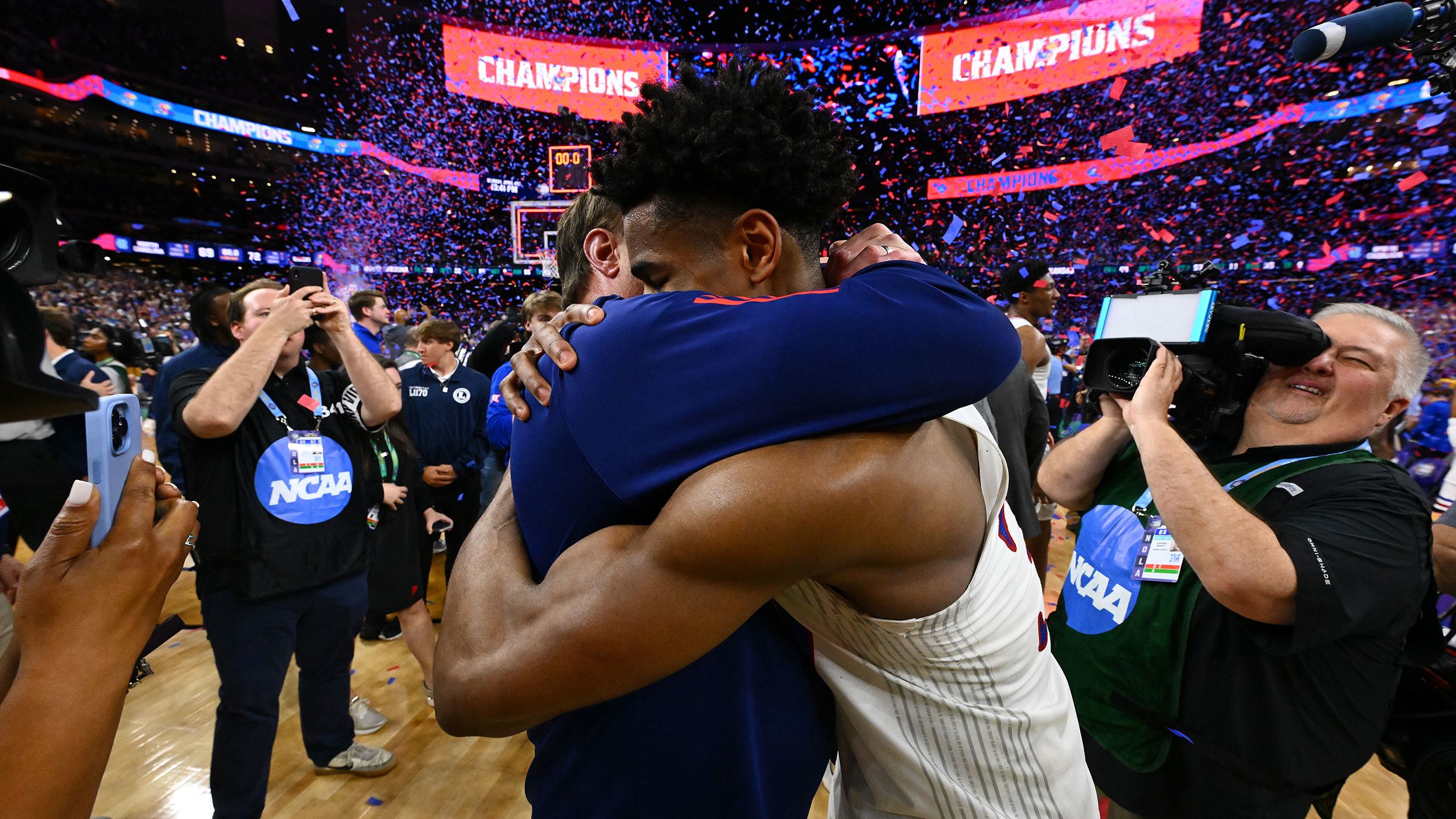 Self and Kansas' Ochai Agbaji hug after the game. Agbaji was named the NCAA Tournament's Most Outstanding Player.