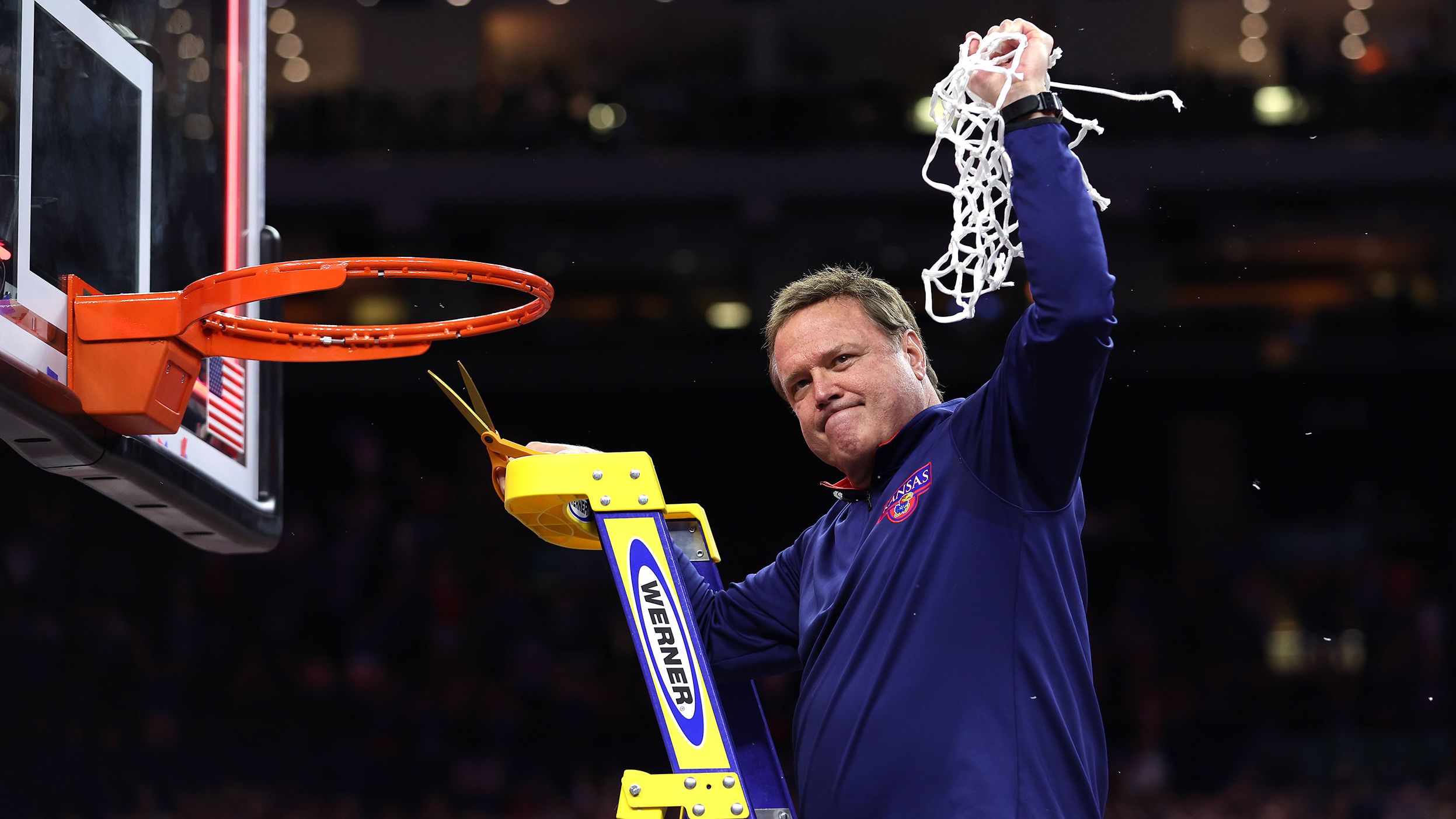 Kansas head coach Bill Self cuts down the net after the game. This is Self's second national title as head coach of the Jayhawks.