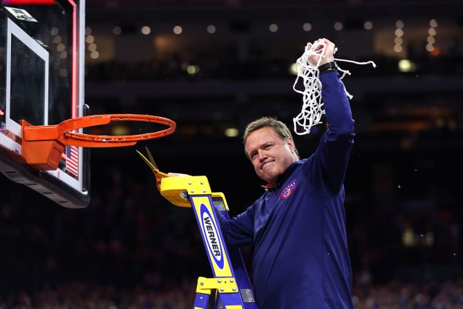 Kansas head coach Bill Self cuts down the net after the game. This is Self's second national title as head coach of the Jayhawks.