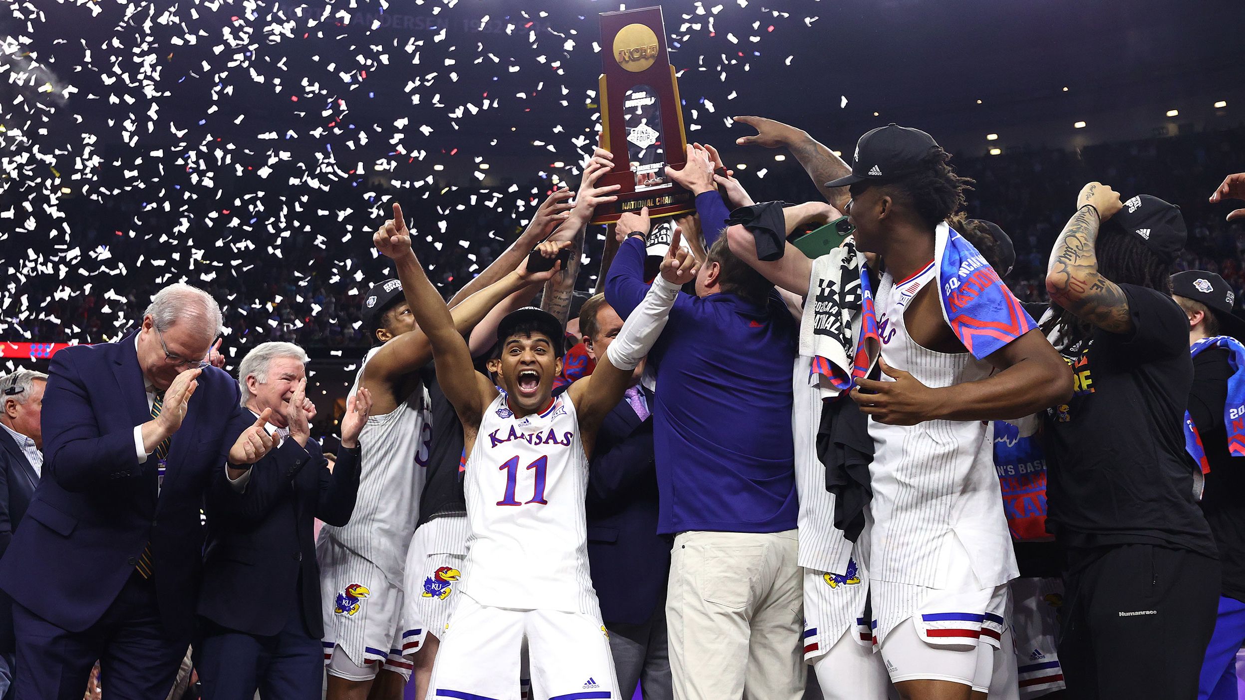 The Jayhawks lift the trophy during the postgame celebrations.