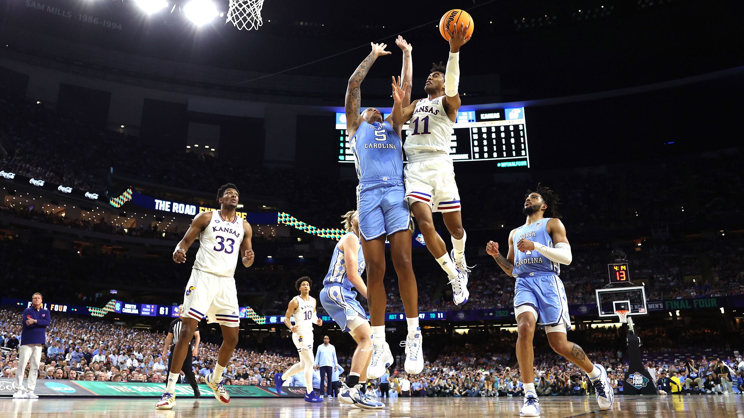 Kansas guard Remy Martin rises for a shot over Bacot. Martin's energy and 3-point shooting played a big part in the Jayhawks' comeback. He finished with 14 points.