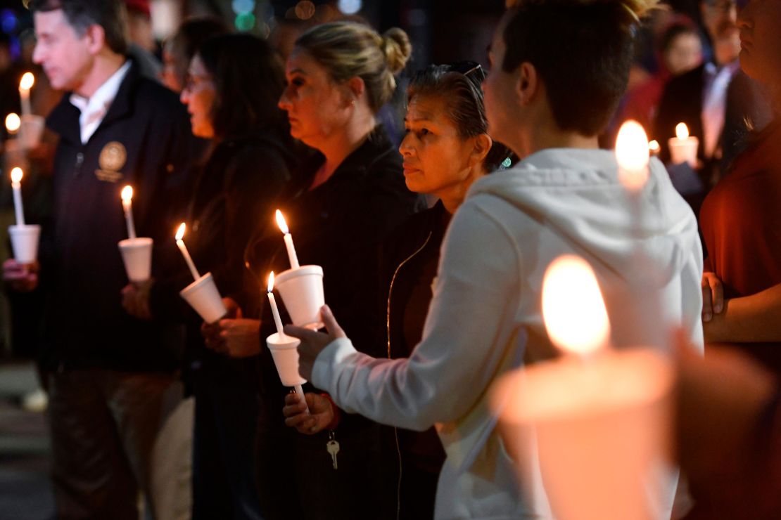 People attend a candlelight vigil for the victims of a fatal shooting held in Sacramento, California, on Monday, April 4, 2022.