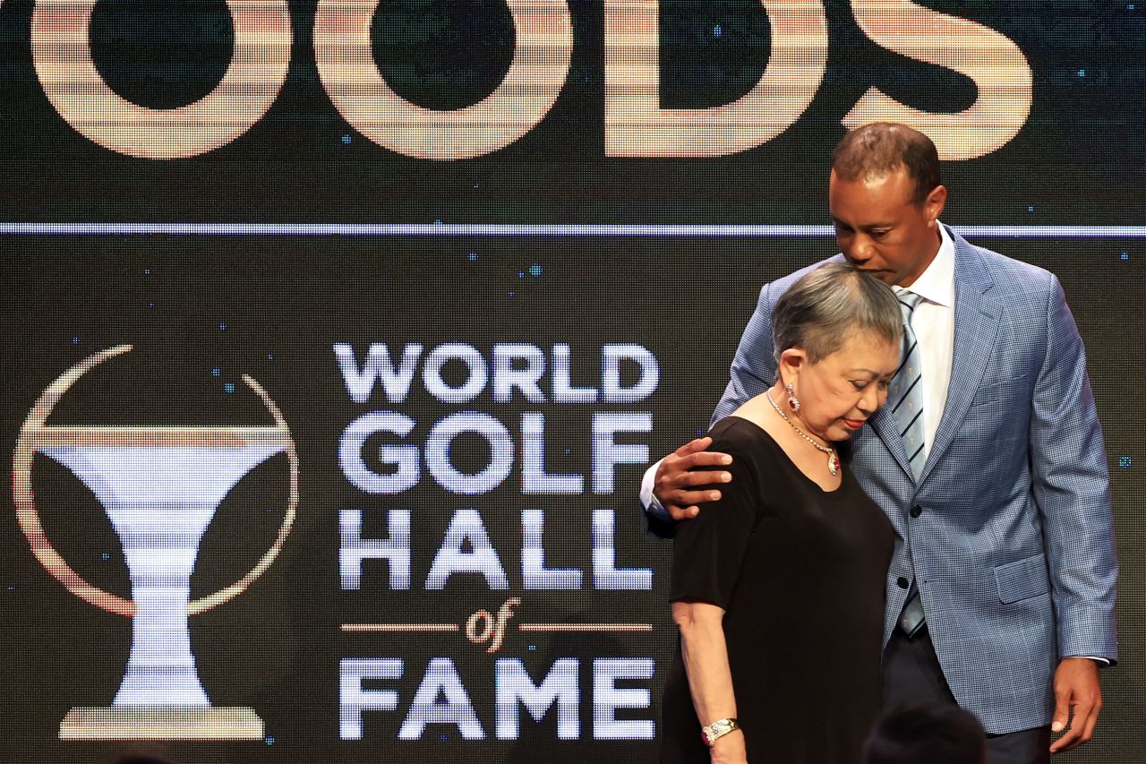 Woods and his mother, Kultida, pose for photos during <a href="https://www.cnn.com/2022/03/10/golf/tiger-woods-golf-hall-of-fame-spt-intl/index.html" target="_blank">his induction into the World Golf Hall of Fame</a> in March 2022. "I had unbelievable parents, mentors, friends who supported me in the darkest of times and celebrated the highest of times," he said in his acceptance speech. "All of you allowed me to get here, and I want to say thank you very much from the bottom of my heart."