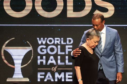 Woods and his mother, Kultida, pose for photos during <a href="https://www.cnn.com/2022/03/10/golf/tiger-woods-golf-hall-of-fame-spt-intl/index.html" target="_blank">his induction into the World Golf Hall of Fame</a> in March 2022. "I had unbelievable parents, mentors, friends who supported me in the darkest of times and celebrated the highest of times," he said in his acceptance speech. "All of you allowed me to get here, and I want to say thank you very much from the bottom of my heart."