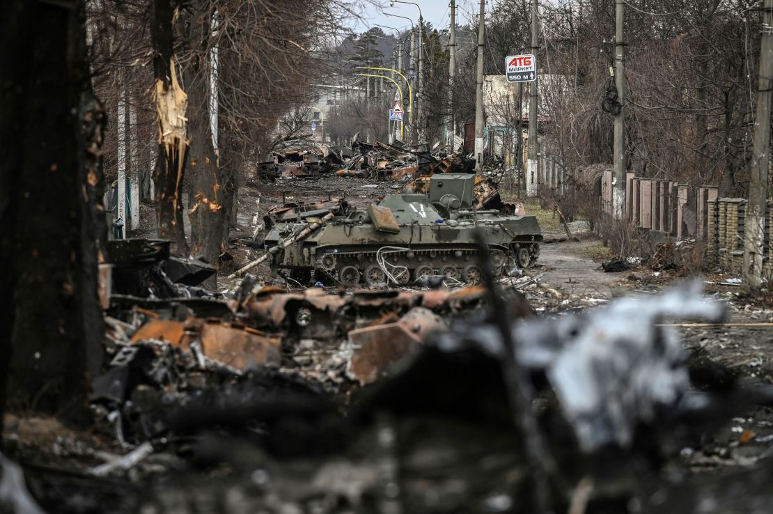 Destroyed Russian armored vehicles are seen on the streets of Bucha.