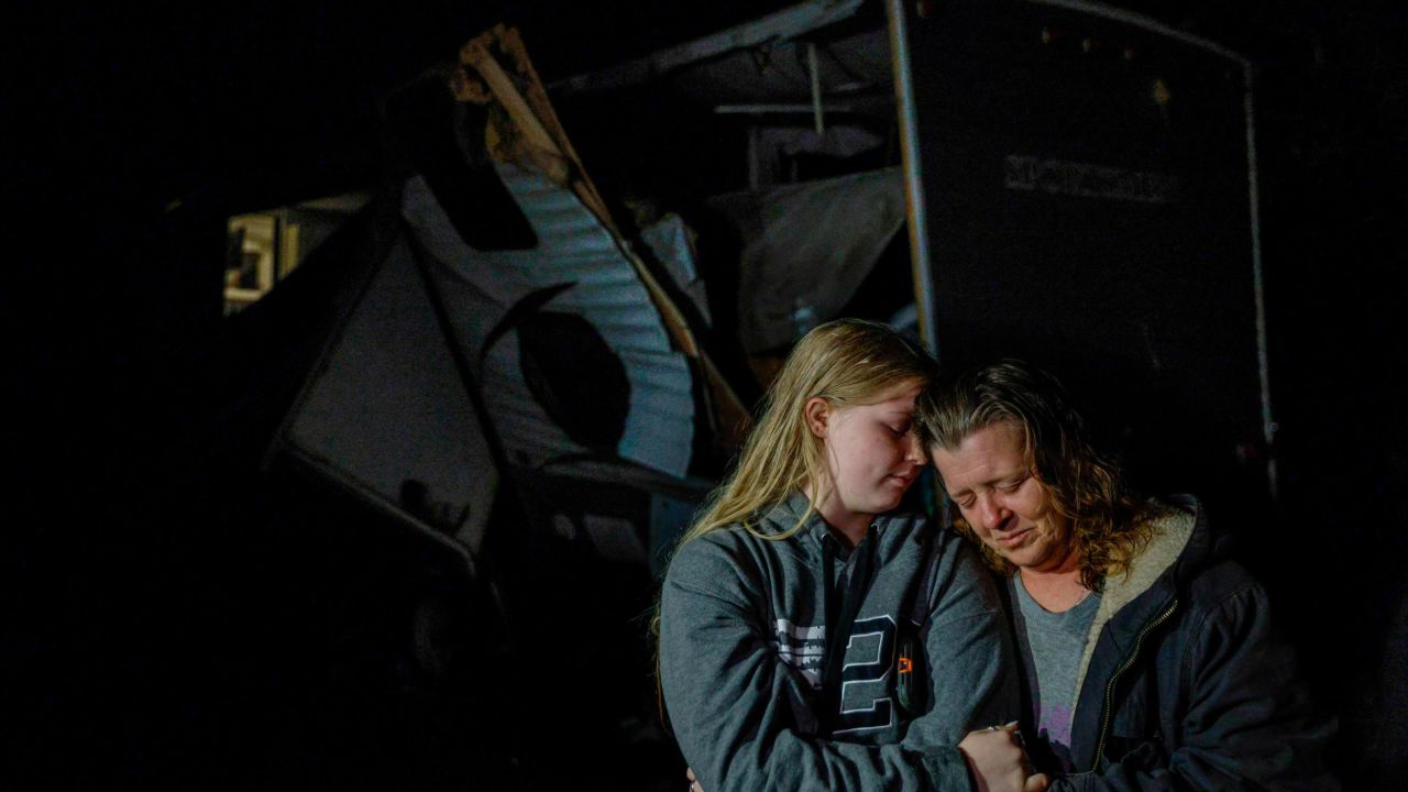 Amber Zeleny, 53, right, is comforted by her daughter Brittaney Deaton, 17, on Tuesday after a severe storm in Johnson County, Texas.