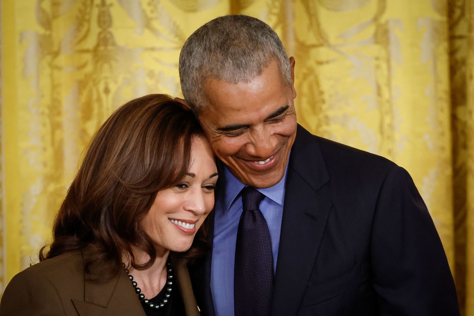 Obama hugs Harris at the event.