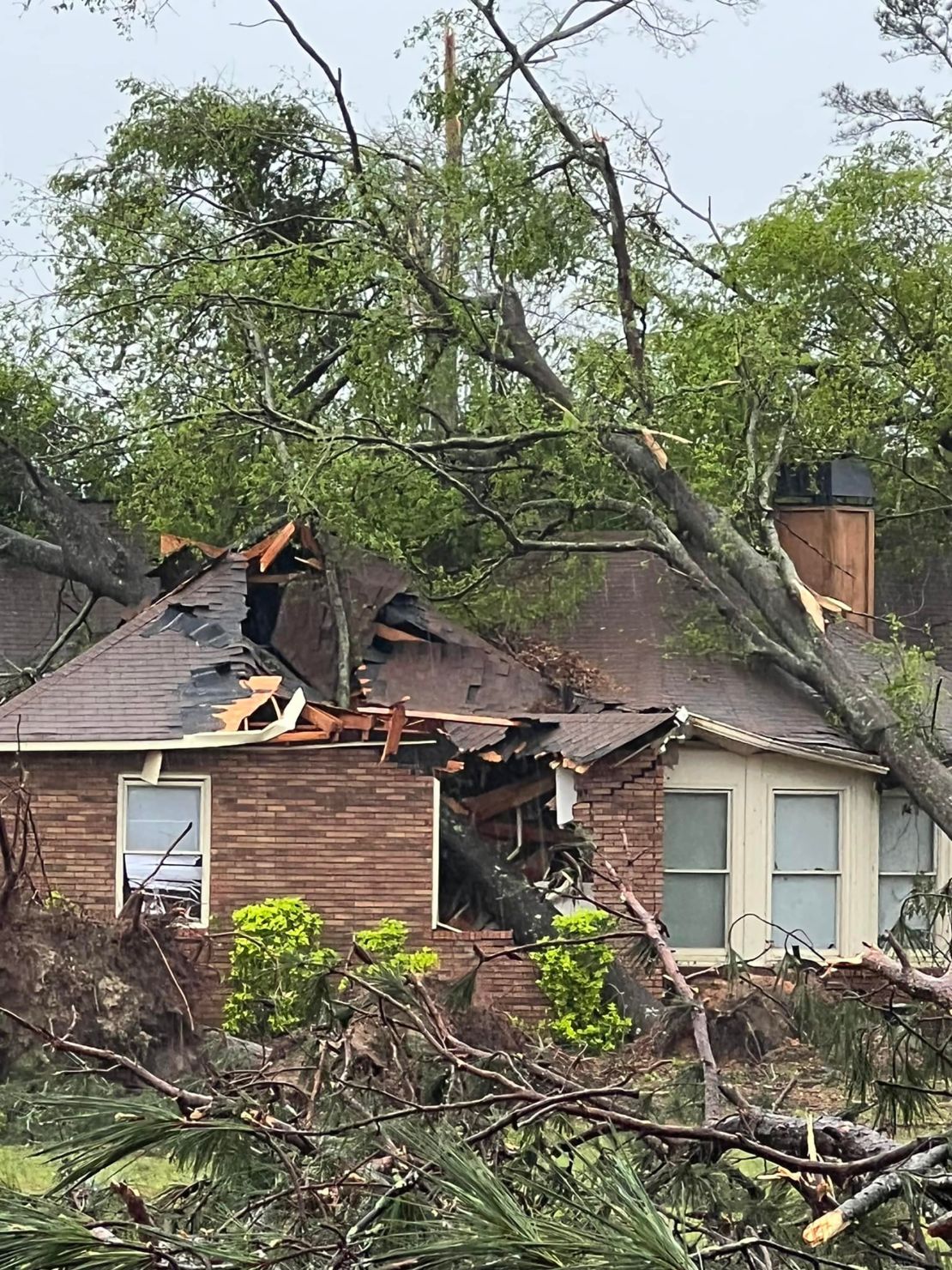 A damaged home in the Georgia neighborhhood of Randell Petrie, who said he and his family hid in a closet when they heard what sounded like a train. 