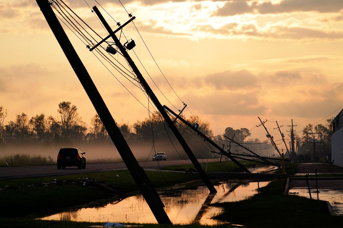 Downed power lines slump over a road in the aftermath of Hurricane Ida in Reserve, Louisiana, in 2021.