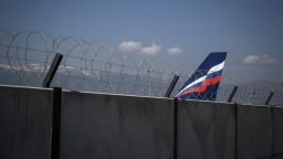 The tail of an Airbus A321-211 aircraft of Russian airline Aeroflot with registration VP-BOE is seen over the wall of the long term parking for planes of Geneva Airport on March 25, 2022. Due to sanctions imposed on Russia over the country's invasion of Ukraine, Russian carrier Aeroflot was banned from the airspace of whole Switzerland. 
