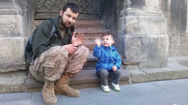 Mikhail with his son, Semen, during his previous deployment, in 2014.