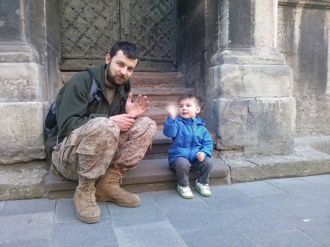 Mikhail with his son, Semen, during his first service in 2014.